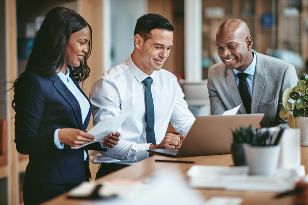 A Man Showing Work to His Colleagues